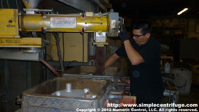 Filling the molds with sand.