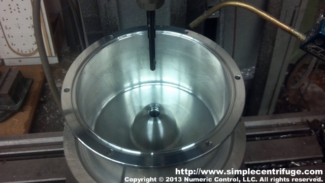 Rotor bottom has been drilled and deburred in preparation for the installation of the captive nuts.