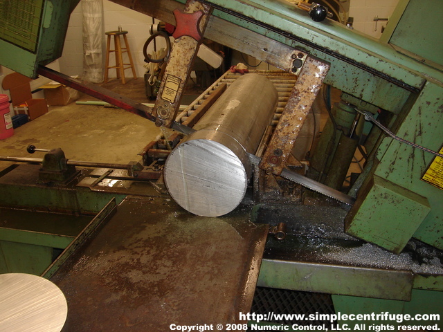 We have started cutting the bar stock for the trial runs on the new lathe. The bar stock is 9.5 inches in diameter. The slab starts out about 21.2 lbs and when it's finished the rotor will weigh about 3.6 lbs.