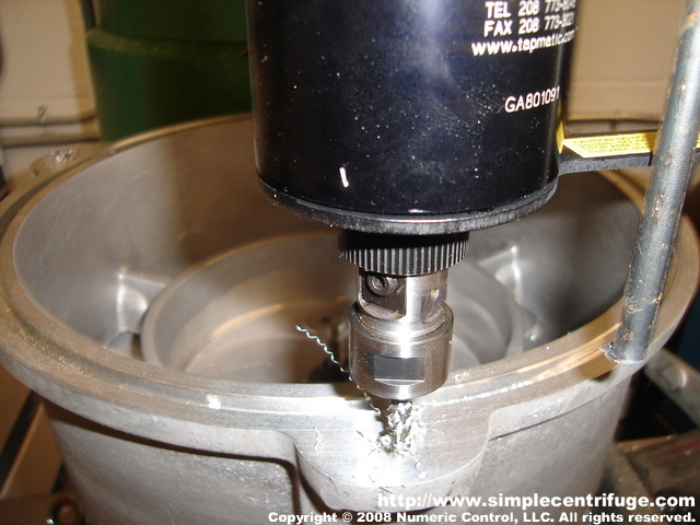 Tapping the centrifuge body casting for the studs.