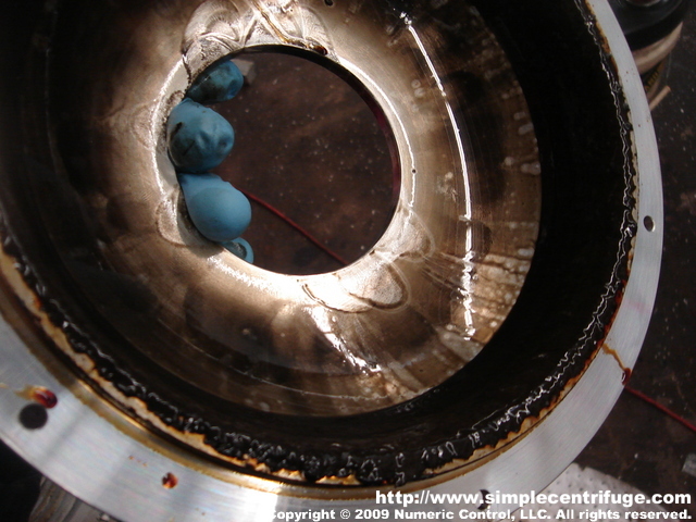 This is the scum line from the two part rotor. You can see clearly the separation line from the dirty waste and the cleaner oil. This photo demonstrates the true value of the feed cone assembly. By forcing all the incoming oil to the back of the rotor only the lightest oil will make it to the front lip and out.