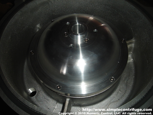 This is the rotor installed. Note the three holes on the top. The oil now exits those holes rather than around the entire edge of the lid. This smooths the flow inside the rotor.