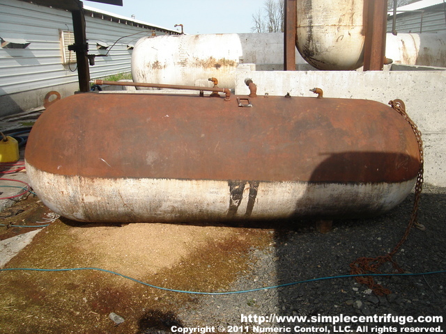 This is a used oil tank we recovered after a fire. Note how the paint was burned off the top of the tank but not the bottom. The recovered oil was really nice after being heated so hot. The tank had a thick layer of crud on the bottom that fell out of the oil during the fire.