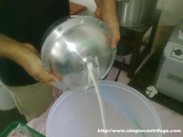 After freezing the mixture is passed through the centrifuge. The liquid milk is retained in the rotor. Here it's being drained.
