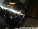 After the part is parted off the bar it's flipped around in a collet ready to be machined.