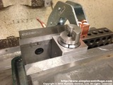 The fixture is then flipped upright and the clamp is slit, finishing the part.