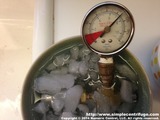I then replaced the hot water with ice water and watched the pressure drop. Once the ice melted and the water acclimated to room temperature the pressure has remained constant over the past several days. 