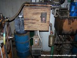 The 1 cu.ft. oil heater. The thermostat controls it between 150-200' F. Oil is pumped over the side from the metering pump on the left, overflows into the centrifuge on the right. 