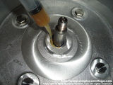 Lay down a nice bead of grease in the seal race. This is a standard axle grease.