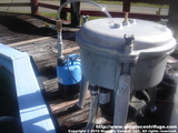 This is the basic setup. The submersible pump has been plumbed with an open T fitting and a ball valve. This allows the pump to deliver a 20 to 30 gallon per hour feed to the centrifuge. The open T allows the remaining pump volume to circulate the pool and keep the algae in suspension.