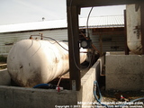 3000 gallon horizontal tank and containment. The tank is so large it serves as a platform for the heater and centrifuge.