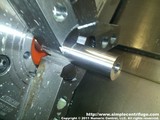 Open the hole with an end mill.